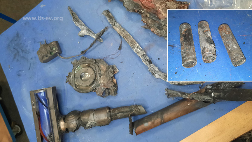 Die Überreste eines brandbetroffenen Akkustaubsaugers von Dyson. Einige Akkuzellen sind thermisch durchgegangen.